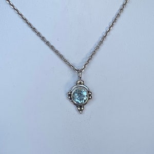 Aquamarine pendant set with sterling silver, natural gemstone, faceted round aqua blue