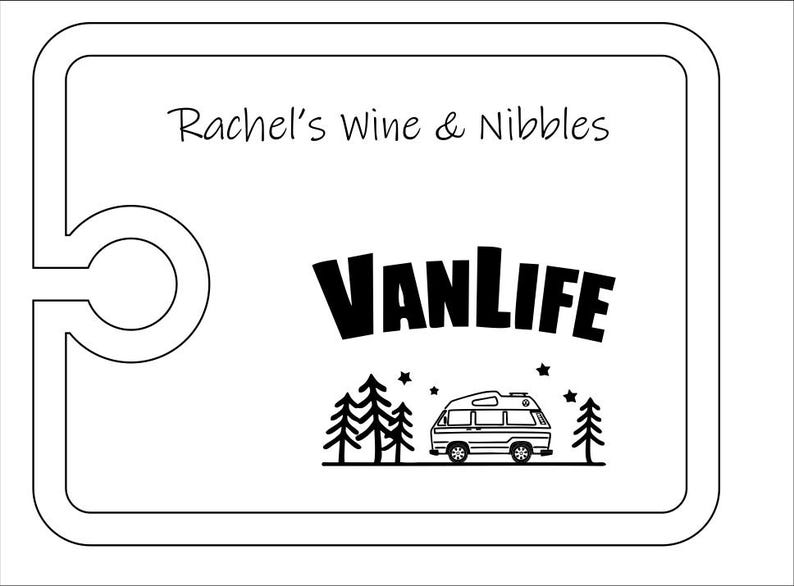 May include: A rectangular white serving board with rounded corners and a circular cutout on the left side. The text Rachel's Wine & Nibbles is printed at the top, with the word VANLIFE and a graphic of a camper van, trees, and stars below.