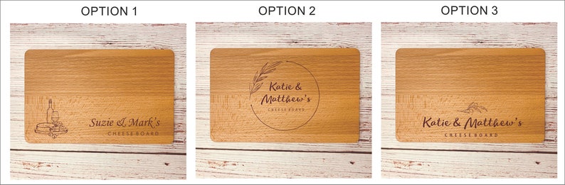 May include: Three wooden cutting boards with different engraved designs. The first board has a wine bottle and cheese design with the text "Suzie & Mark's Cheeseboard". The second board has a floral design with the text "Katie & Matthew's Cheeseboard". The third board has a simple floral design with the text "Katie & Matthew's Cheeseboard".