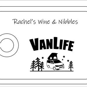 May include: A rectangular white serving board with rounded corners and a circular cutout on the left side. The text Rachel's Wine & Nibbles is printed at the top, with the word VANLIFE and a graphic of a camper van, trees, and stars below.