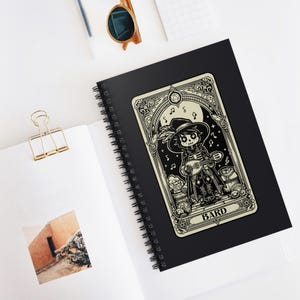 May include: A black and white illustration of a skeleton bard playing a lute. The illustration is on a card with the word "BARD" at the bottom. The card is on a black background.