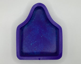 May include: Purple silicone mould with a rectangular shape and a rounded top. The mould has a speckled blue and white interior.