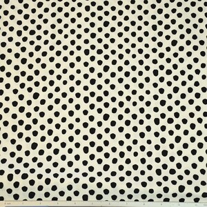 May include: White fabric with a black polka dot pattern. The dots are arranged in a swirling, concentric pattern.