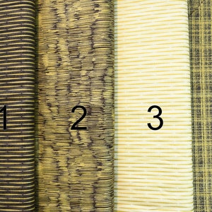 May include: Four fabric swatches with different textures and patterns. The swatches are labelled 1 through 4. The swatches are all in shades of brown and yellow.