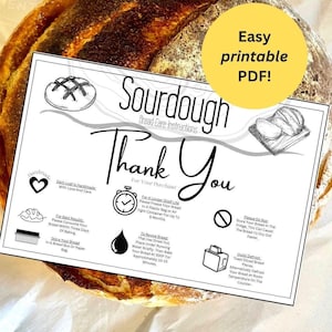May include: A black and white printable card with sourdough bread care instructions. The card has a title that says "Sourdough Bread Care Instructions" and a thank you message. The card includes icons and text about storing, reviving, and defrosting sourdough bread. The card is on top of a brown paper bag with a loaf of sourdough bread.
