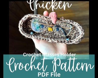 May include: Crochet pattern for a glasses holder shaped like a chicken. The holder is brown and white with a pink comb and yellow beak. The pattern is available as a PDF file.