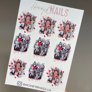 May include: A white sticker sheet labeled Honey NAILS at the top and @HONEYBNAILS.LA at the bottom. The sheet features eight repeating clusters of horror movie character illustrations, including figures with red blood splatters and a red balloon.