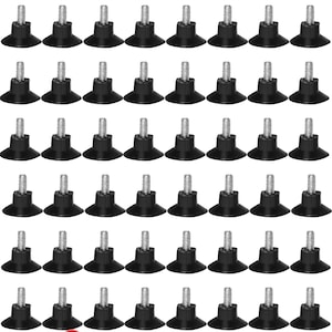 May include: 48 black plastic furniture feet with a threaded screw. Each foot has a wide base and a narrow top. Free shipping.