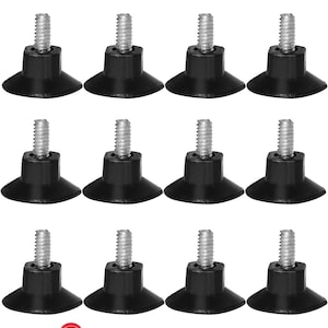 May include: Twelve black plastic furniture feet with a threaded screw and a wide base. The feet are designed to protect floors from scratches and provide stability to furniture.