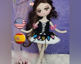 May include: A handmade crochet doll with long brown hair and a black and white dress. The doll has a detailed face with large eyes and is wearing ballet shoes. The doll is approximately 10 inches tall.