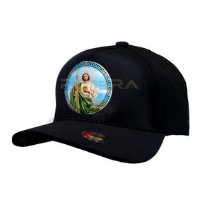 May include: Black baseball cap with a circular image of a saint holding a staff. The image is surrounded by a gold-colored Greek key pattern.