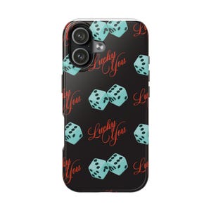 May include: A black smartphone case featuring a repeating pattern of light blue dice with black dots and the red cursive text Lucky You. The design includes multiple pairs of dice scattered across the surface, with the camera lens cutout at the top.