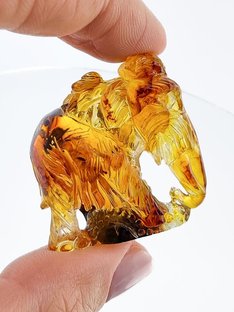 Natural Baltic Amber Carved Mammoth Honey Color Figurine with In Natural Baltic Amber Carved Mammoth Honey Color Figurine with In