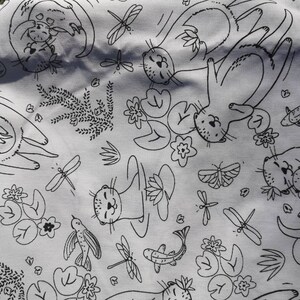 May include: Black and white fabric with a repeating pattern of otters holding each other, lily pads, dragonflies, and fish. The fabric has a light gray background.