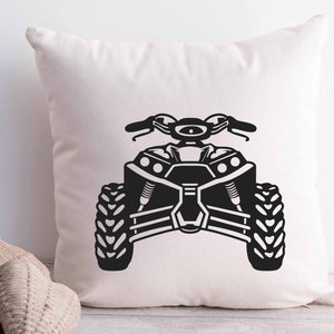 May include: Black and white silhouette of an ATV on a white pillow. The ATV has a roll cage and four wheels.