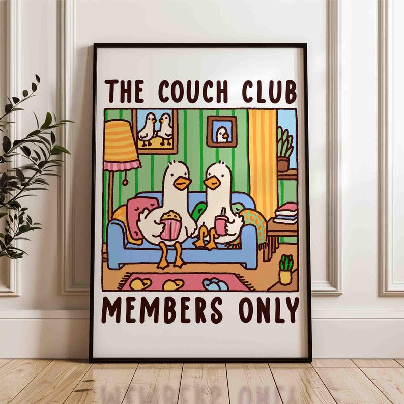 May include: A colorful illustration of two ducks sitting on a couch with popcorn and a drink. The text "THE COUCH CLUB MEMBERS ONLY" is printed on the poster.
