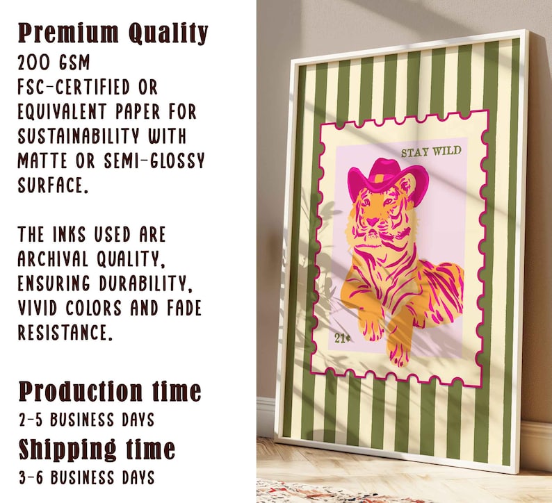 May include: A framed art print with a tiger wearing a pink cowboy hat, set against a pink background with the words "STAY WILD". The print is in a white frame with a green and white striped border. The text on the left side says "Premium Quality".