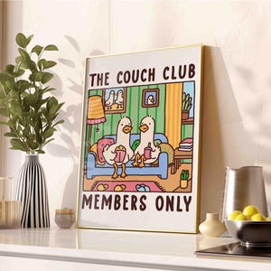 May include: A colorful illustration of two ducks sitting on a couch with the text "The Couch Club Members Only".