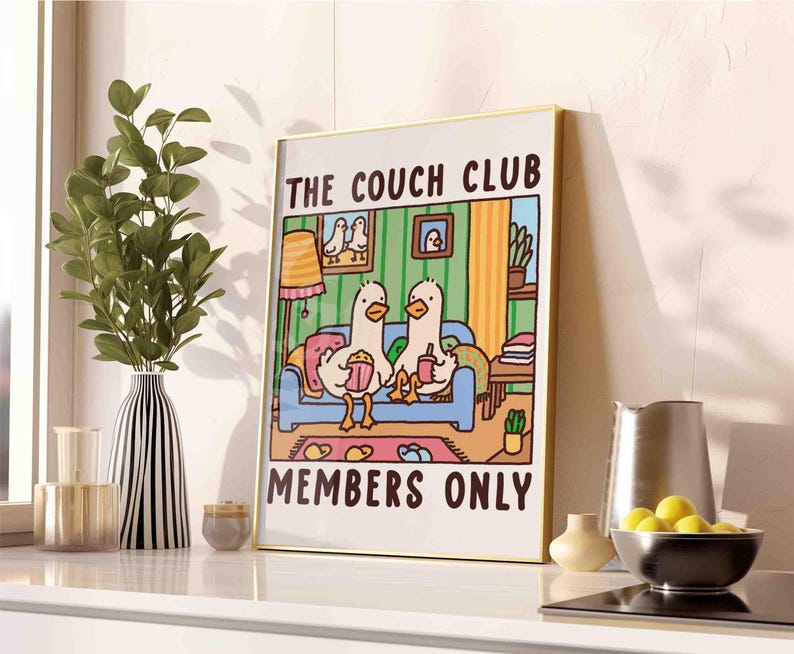 May include: A colorful illustration of two ducks sitting on a couch with the text "The Couch Club Members Only".