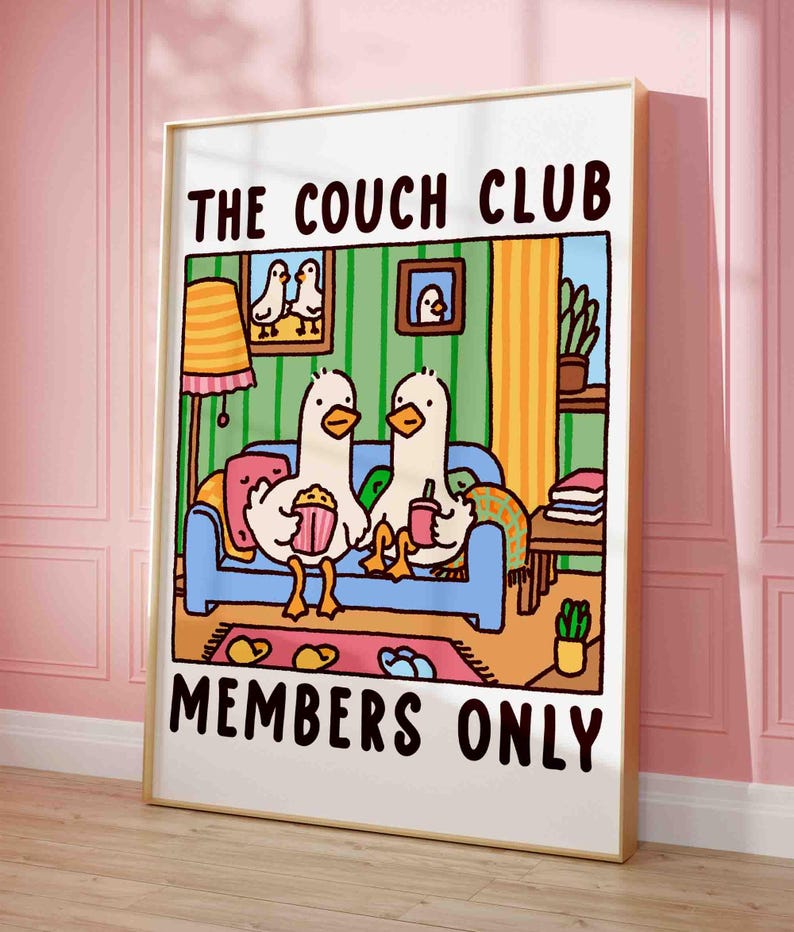 two cute goose sitting on a sofa holding hands (or should I say wings) in a retro looking apartment, funny print for your home decor. the text reads: he couch club members only