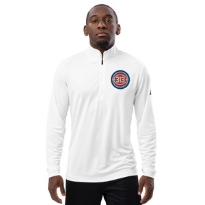 May include: White long-sleeve athletic shirt with a quarter-zip closure. The shirt features a red and blue embroidered logo with the number "313" on the left chest.