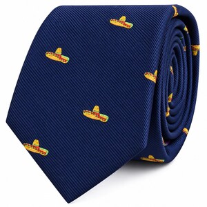 May include: A dark navy blue necktie featuring a repeating embroidered pattern of small yellow, red, and green sombreros. The fabric has a distinct diagonal ribbed texture throughout the entire surface of the tie, which is rolled at the end.