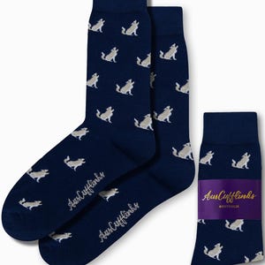 May include: A pair of navy blue socks with a white wolf pattern. The socks are packaged with a small card that says "AusCufflinks AUSTRALIA".