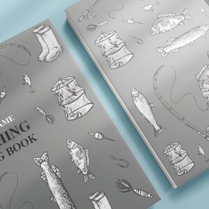 May include: Two gray fishing log books with a variety of fishing-themed illustrations, including fish, fishing rods, and tackle boxes. The text on the cover reads "Your Name Fishing Log Book".