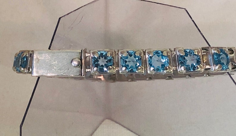 handmade one of a kind Swiss Blue Topaz and silver tennis bracelet