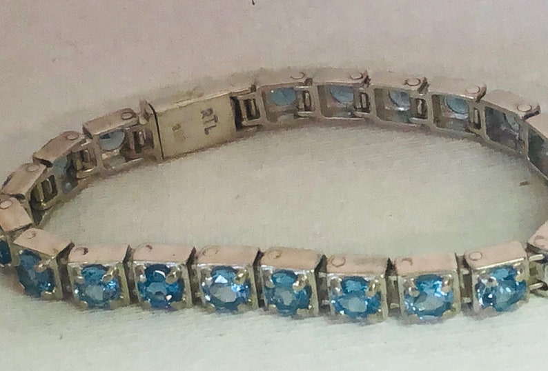 handmade one of a kind Swiss Blue Topaz and silver tennis bracelet