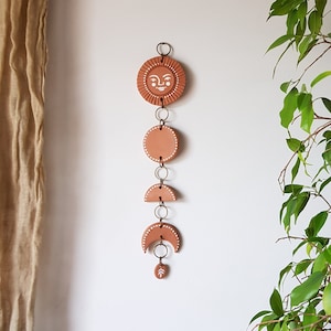 Terracotta sun and moon phases wall hanging Sun face wall decor Modern clay wall hanging Ceramic geometric wall art