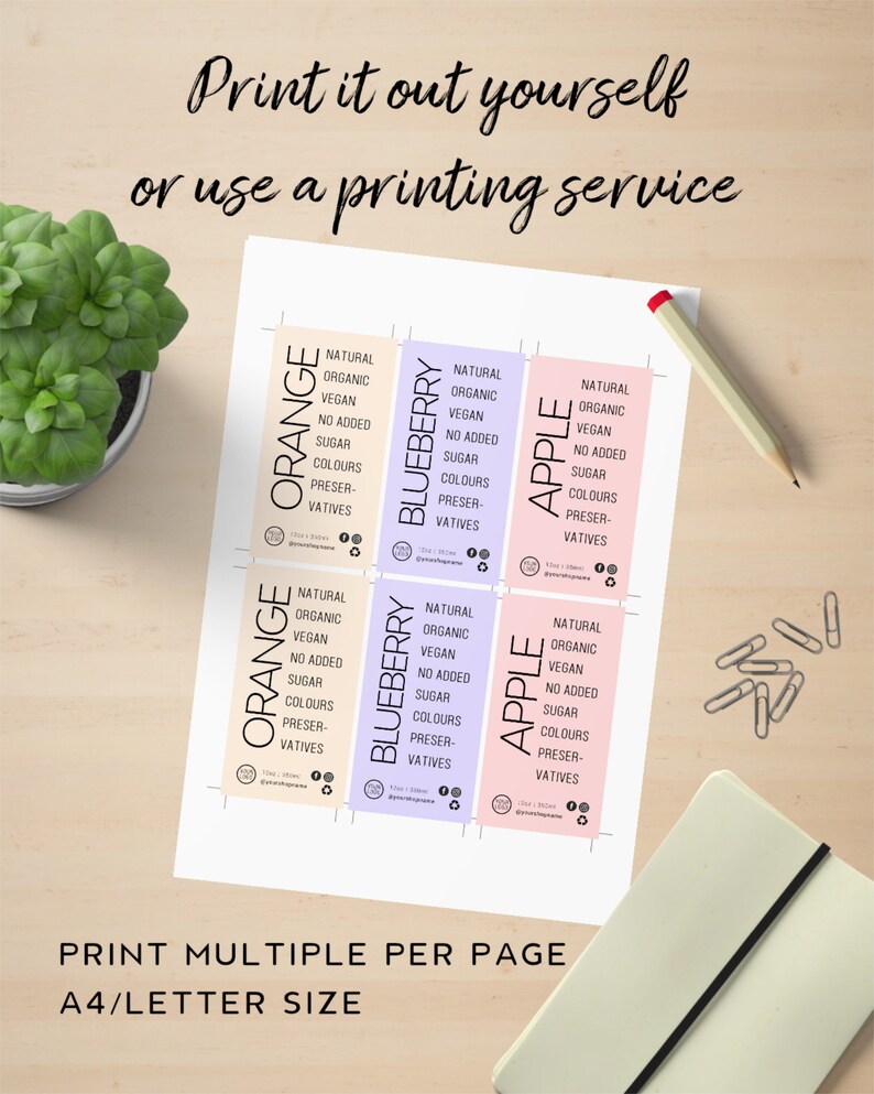 May include: Printable labels for food products, featuring orange, blueberry, and apple flavours. The labels are designed with a natural, organic, vegan, and no added sugar theme. The text "Print multiple per page A4/letter size" is included at the bottom.