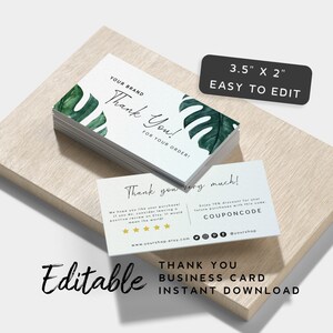 May include: Editable thank you business card template with a tropical leaf design. The card is 3.5 inches by 2 inches and features the text "Thank You!" and "Thank you very much!" along with a discount code and social media icons.
