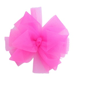 May include: A large pink tulle bow, perfect for adding a touch of elegance to any occasion.