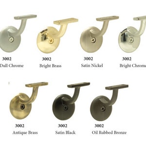 May include: A set of six metal handrail brackets in various finishes: dull chrome, bright brass, satin nickel, bright chrome, antique brass, satin black, and oil rubbed bronze. Each bracket has a round base and a curved arm.