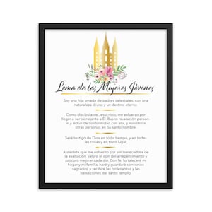 May include: A black framed print with a gold and white image of the Salt Lake Temple and a floral design. The text "Lema de las Mujeres Jóvenes" is at the top of the print. The text below the image reads: "Soy una hija amada de padres celestiales, con una naturaleza divina y un destino eterno."