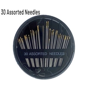 May include: A round black plastic container with a clear lid filled with 30 assorted needles. The container has the text "30 Assorted Needles" printed on the lid.