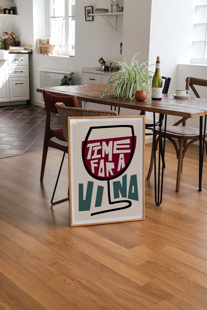 May include: A framed poster with a stylized illustration of a wine glass with the text "Time for a Vina" in red, blue, and white.