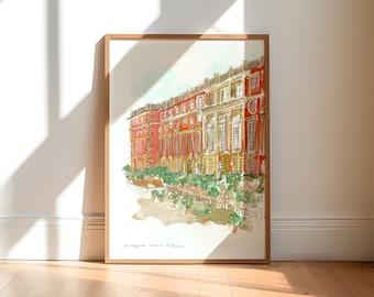 May include: Watercolor print of Hampton Court Palace in a wooden frame. The artwork depicts the palace's red brick facade with yellow accents and green foliage. The print is displayed on a white wall with natural light and shadows.