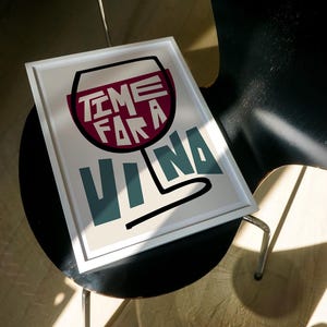 May include: A white framed print with a red wine glass illustration and the text "Time for a Vina" in white and teal lettering.