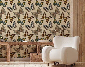 May include: A beige wallpaper with a repeating pattern of colorful butterflies. The butterflies are in various shades of brown, yellow, green, and blue. The wallpaper is shown in a room with a white armchair and a wooden table.