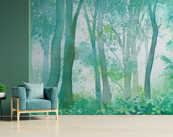Könnte beinhalten: Ein Aquarellbild einer Waldszene in Grün- und Blautönen. Das Bild zeigt eine Gruppe von Bäumen mit sichtbaren Stämmen und Laub im Hintergrund. Das Bild ist gerahmt und hängt an einer Wand in einem Raum mit einer grünen Wand und einem blauen Sessel.