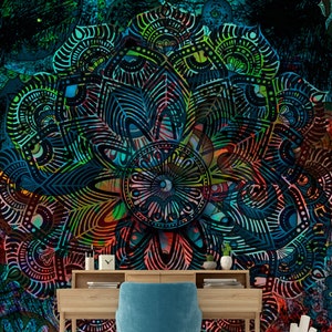 May include: A teal blue office chair with a wooden desk in front of a colourful mandala wall mural. The mandala features intricate patterns in shades of blue, green, red, and yellow.