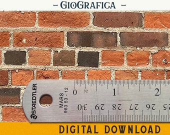May include: A close-up of a brick wall texture with a ruler measuring 2 inches. The ruler is labeled "Staedtler Mars 963 53-12".