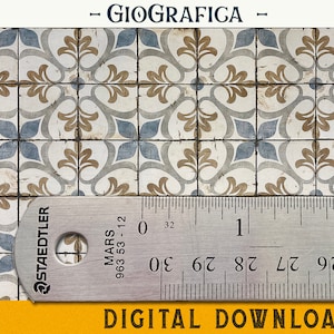 May include: A close-up of a ruler measuring a pattern of blue, brown, and white tiles. The ruler is labeled "Staedtler Mars 963 53-12" and shows measurements in inches. The tiles have a floral design.