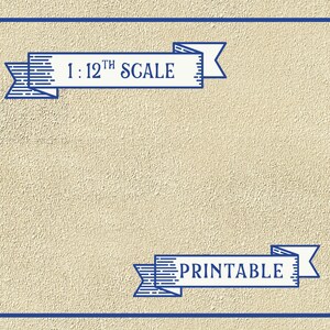 May include: A printable template for a 1:12th scale dollhouse. The template is framed in a blue border and has the text "1:12th SCALE" and "PRINTABLE" in blue ribbon banners.