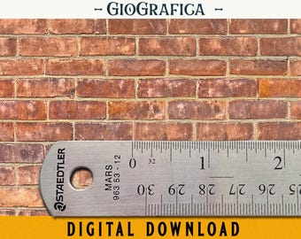 May include: A close-up of a red brick wall with a ruler measuring 2 inches across the bottom. The ruler is silver with black markings and the text "STAEDTLER MARS 963 53-12" printed on it.