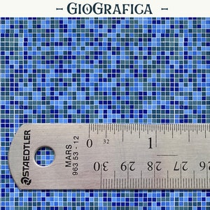 May include: A close-up of a blue and gray mosaic tile pattern. A ruler is placed on top of the tile pattern, showing measurements in inches. The ruler is labeled "Staedtler Mars 963 53-12".