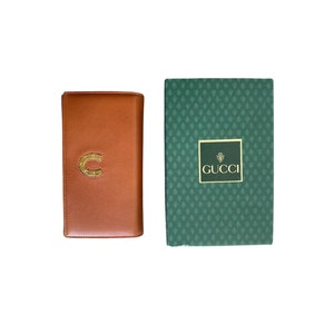 Authentic Gucci GG Brown Leather & Canvas New Britt Bi-Fold Wallet –  Vanilla Vintage
