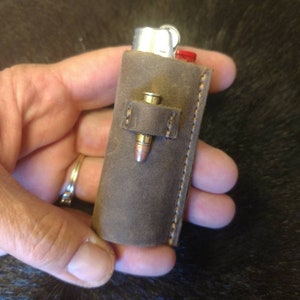 Badass 22 LR bullet lighter case! It&#39;s oil tan leather, holds tight in your hand. And then you always have an extra one handy! Signed by me